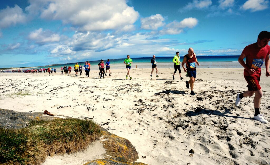 Runners on a Tiree beach